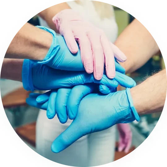 Hands holding the COMS® One therapy unit