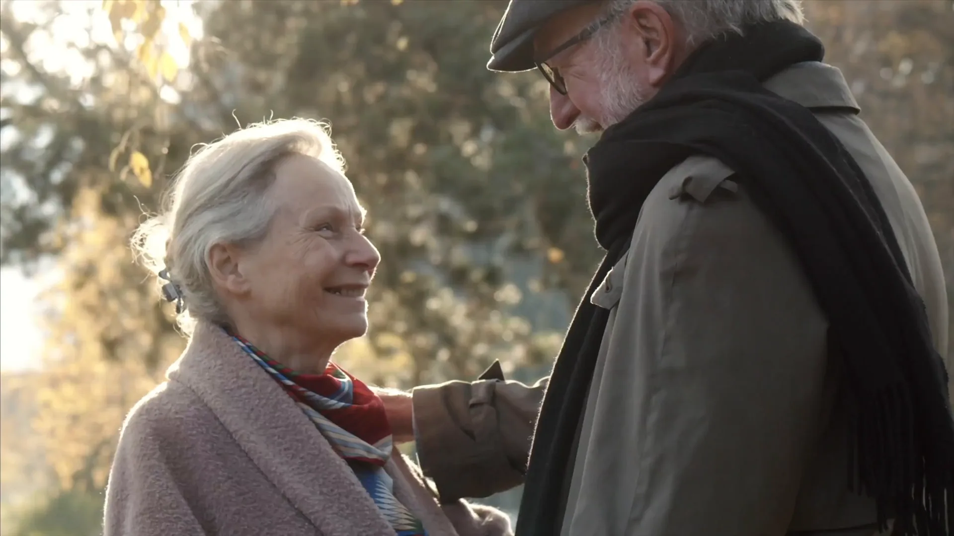 A couple walking together in an autumn park, from the Piomic company film
